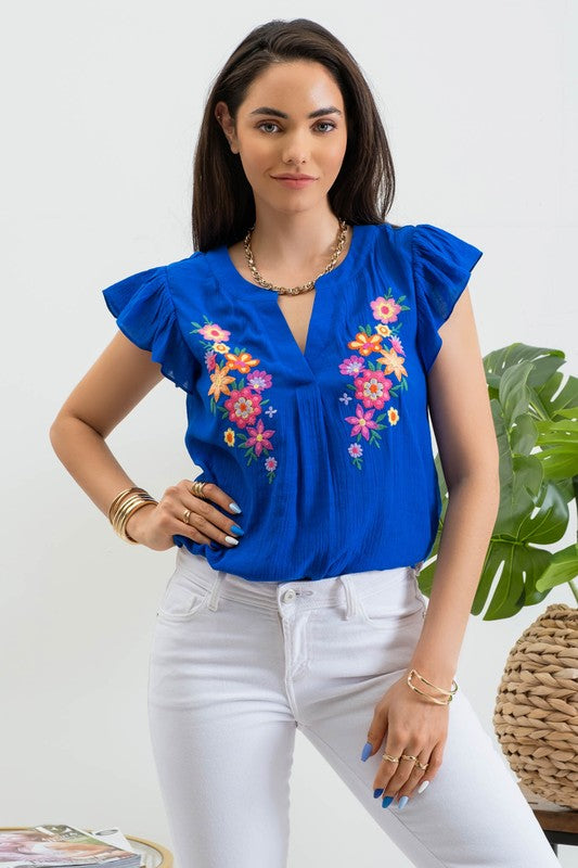 Blusa bordada con manga olán