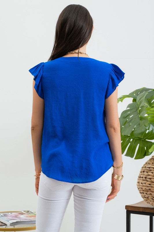 Blusa bordada con manga olán
