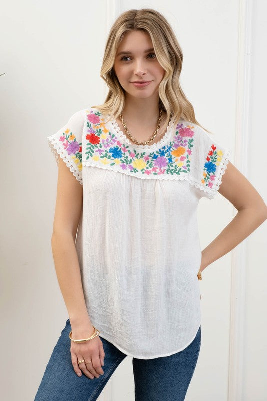 Blusa bordada manga corta