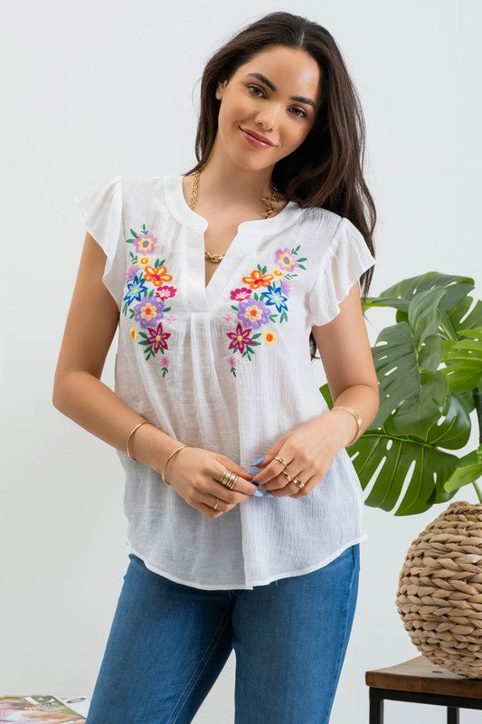 Blusa bordada con manga olán