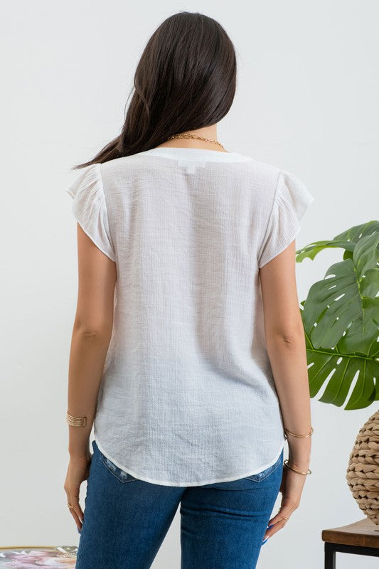 Blusa bordada con manga olán