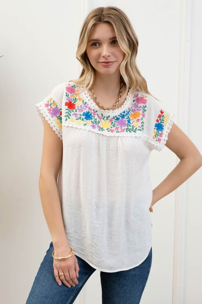 Blusa bordada manga corta
